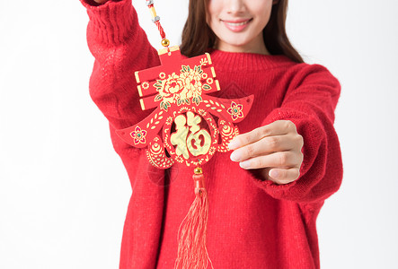 美女新感素材新年女性拿红色中国结背景