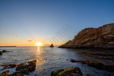 黄海日出岩石海岸高清图片