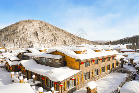 东北大秧歌雪山下的村庄冬景图背景