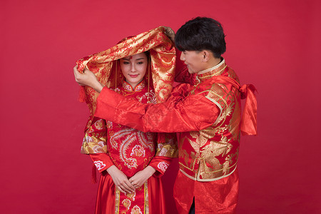 新娘红盖头传统中式婚礼新郎掀起新娘的红盖头背景