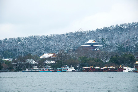 雪中的西湖西湖雪景背景