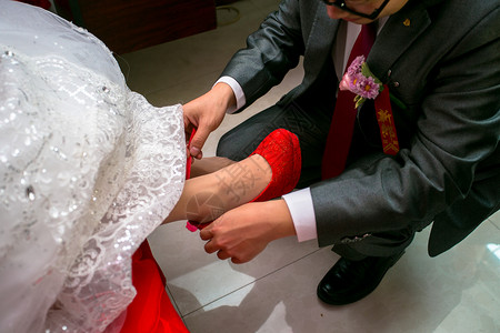 婚礼环节穿鞋背景图片
