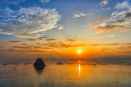 户外捕鱼素材海上的岛屿与日出背景