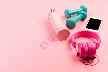 健身耳机素材女性粉色健身静物背景背景