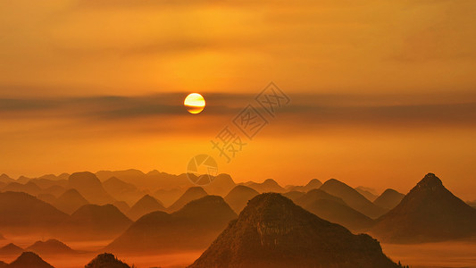 优才金鸡峰的唯美日出背景