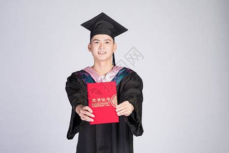 手持荣誉证书的毕业大学生背景图片
