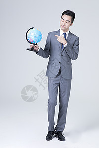 商务男性地球仪拿着地球仪的商务男士背景