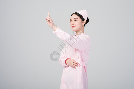 手指点向前方的女护士形象背景图片