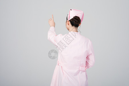 手指点向前方的女护士形象图片