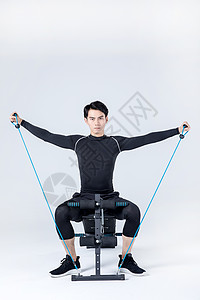 运动男性仰卧板拉绳背景图片