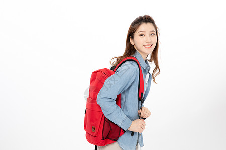 背着书包的女大学生图片