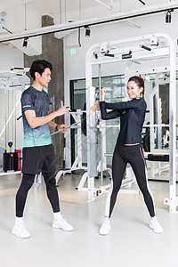 健身房运动健身拉伸热身动作健身器材高清图片素材