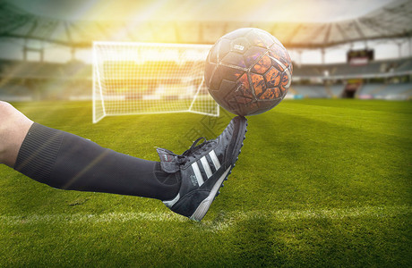 世界杯脚尖上的足球背景图片
