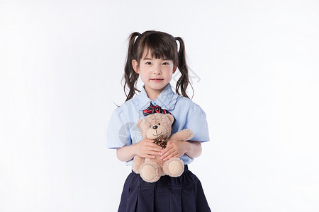 小女孩儿童学生形象手拿玩具熊图片