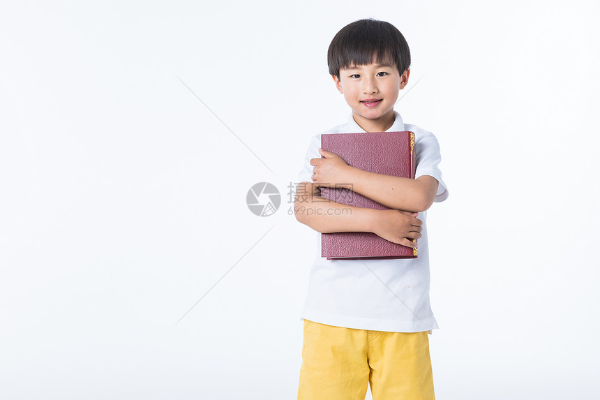 可爱孩子拿着书图片