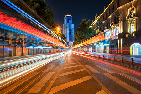 五颜六色建筑武汉中山大道夜晚流光溢彩的城市车轨背景
