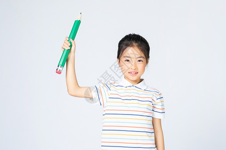 儿童教育拿铅笔的女孩背景图片