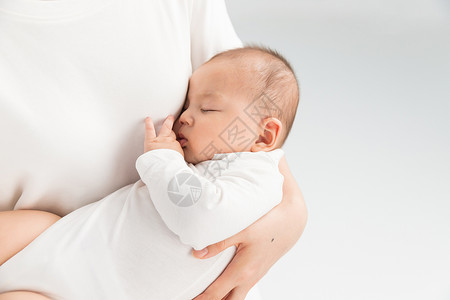 抱着孩子的妈妈母婴妈妈抱着宝宝睡觉背景