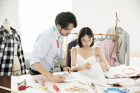 男女服装设计师背景图片