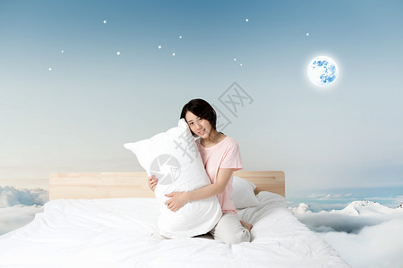 抱着月亮的女孩云层上的床设计图片