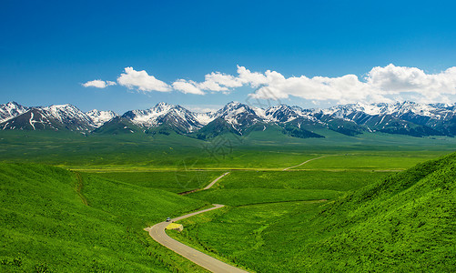 葡萄沟风风景通向雪山的公路背景