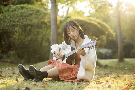 弹吉他的少女文艺少女户外弹吉他背景