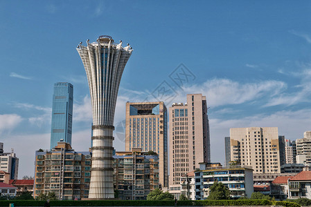 贺龙体育馆运动会火炬塔和长沙城区地标高清图片素材
