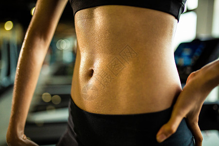 纤细身材运动女性身体腹部特写背景