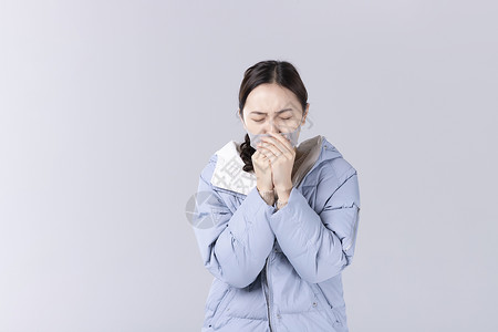 戴着口罩咳嗽的女孩图片