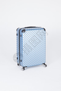蓝色行李箱拉杆箱背景图片