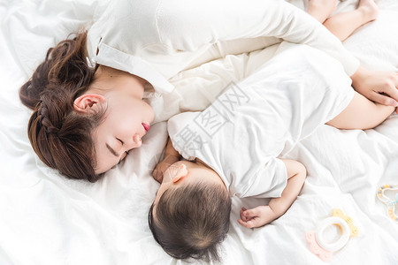 母婴家纺素材妈妈抱着宝宝入睡背景