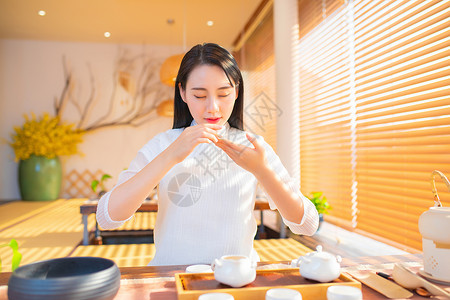 文艺女性品茶背景图片