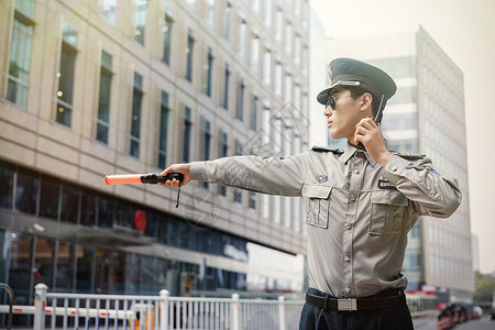 将对讲机警察保安指挥动作背景