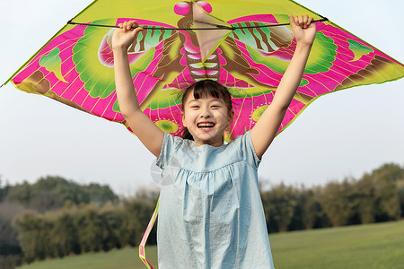 儿童节快乐女孩儿童节放风筝的女孩背景