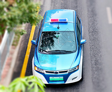 警车素材高清马路上的一辆蓝色的士背景