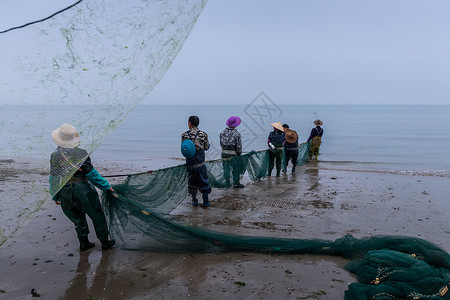 大海撒网广西京族渔民捕鱼场景背景