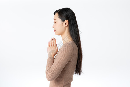 女性祈祷许愿背景图片