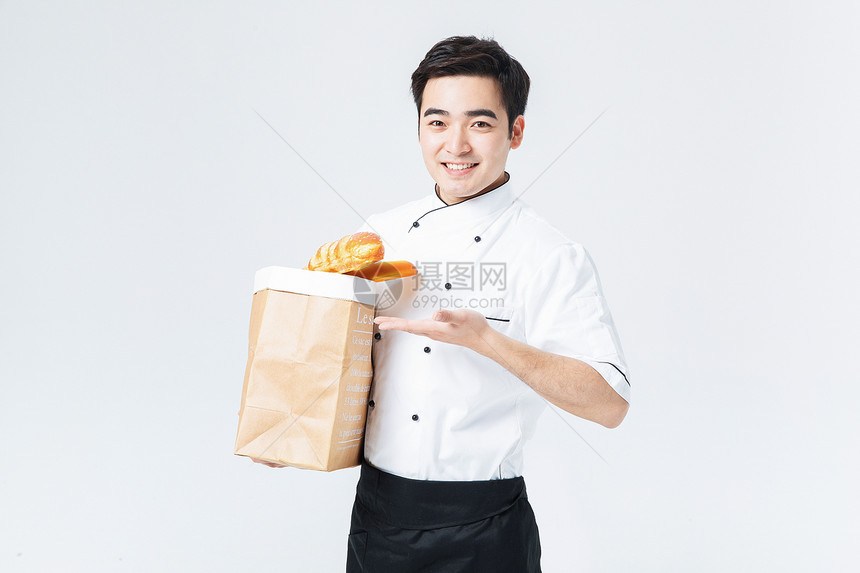 西餐厨师拿着面包图片