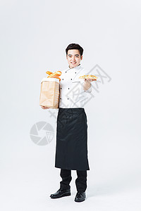 西餐厨师拿着面包背景图片