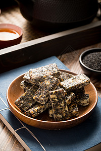 中式传统小吃黑芝麻花生糖背景图片