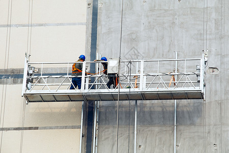 高墙建筑工人背景图片