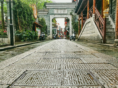 长沙老街老街雨后空寂的麻石板路背景