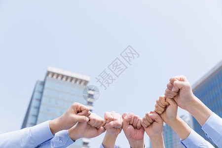 文化力量企业团队握拳团结特写背景