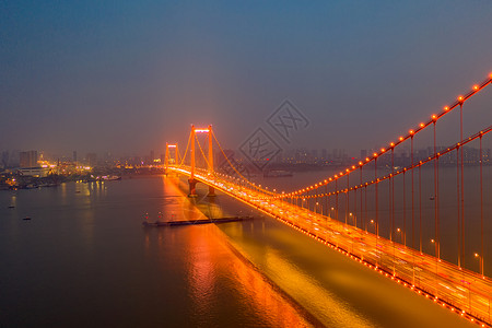 夜晚璀璨灯光下的城市桥梁路灯高清图片素材