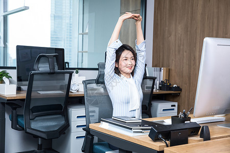 女性办公运动女士在办公室锻炼身体背景
