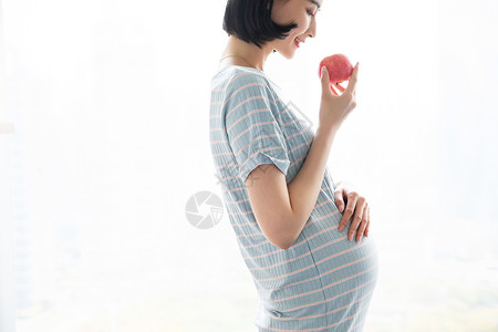 苹果人物孕妇妈妈吃苹果背景