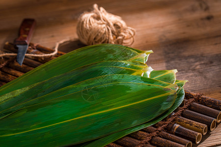 玉米包端午节包粽子的箬叶背景