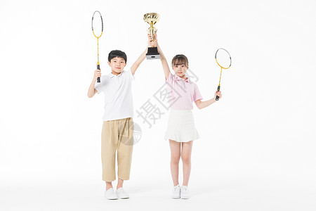 儿童羽毛球比赛获奖高举奖杯高清图片素材