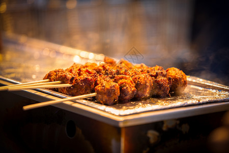 韩式烤肉串夏季烧烤烤串丸子背景