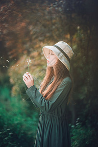 森女森系女孩吹蒲公英背景